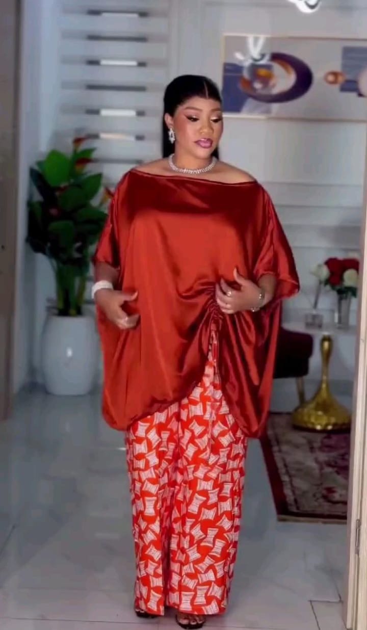 Luxury African dress. Merges femininity with a touch of luxury.