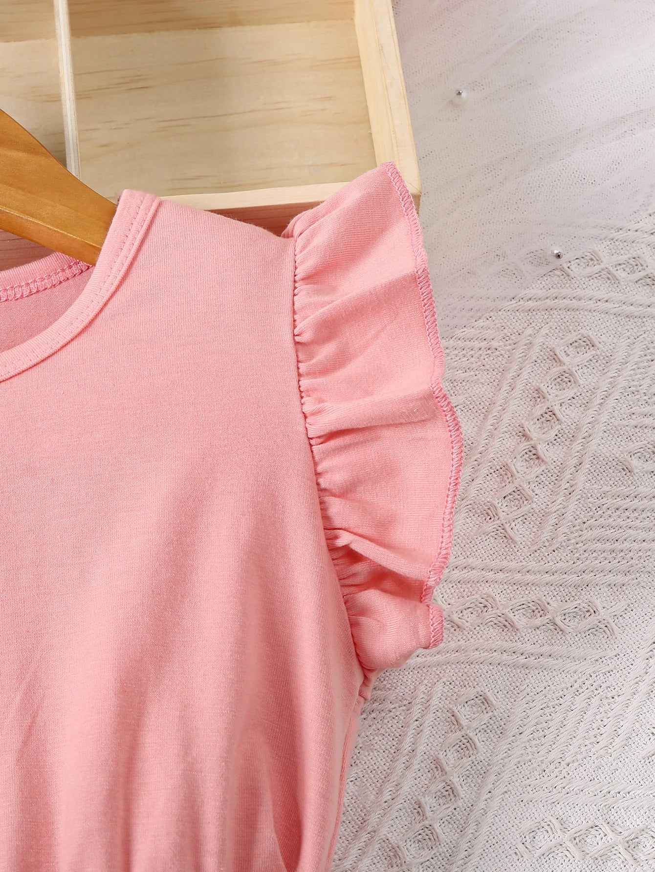 romantic floral print with ruffled edges and small flying sleeves