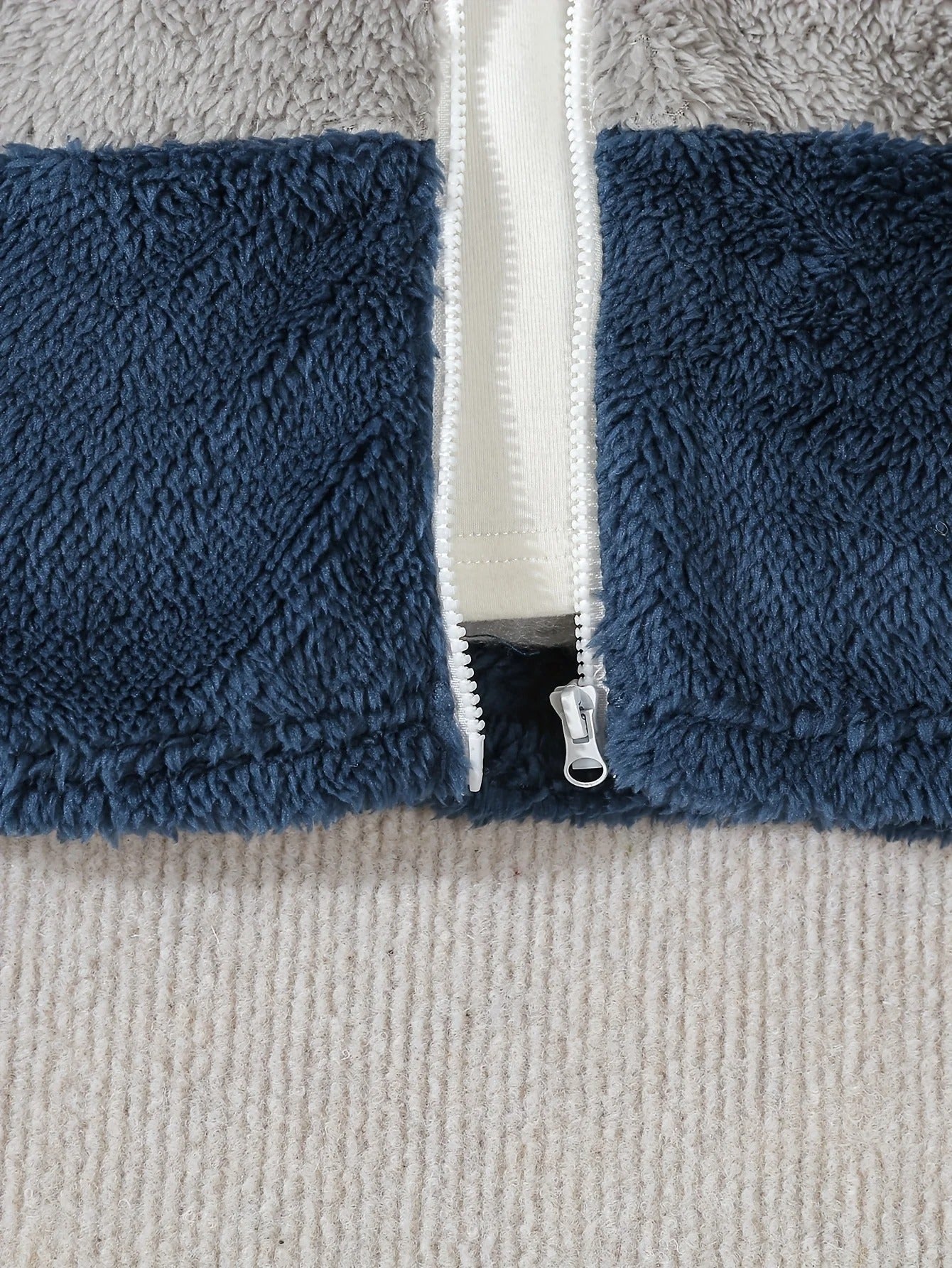 A Cute Little Dinosaur Embroidered Color-Blocking Hood.